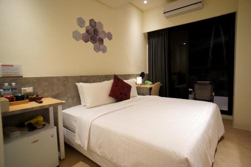 Ένα ή περισσότερα κρεβάτια σε δωμάτιο στο 向陽海 Sun&Sea INN