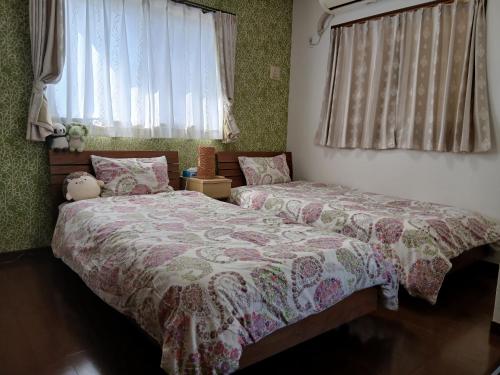 Postel nebo postele na pokoji v ubytování Unbi Stay