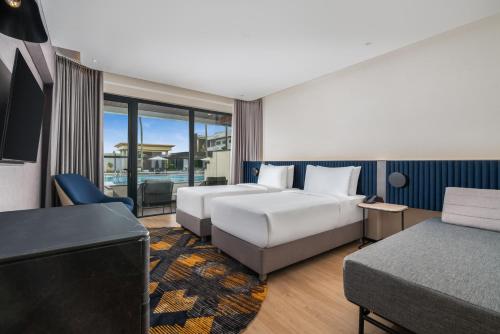 Una cama o camas en una habitación de Novotel Pontianak Convention Centre