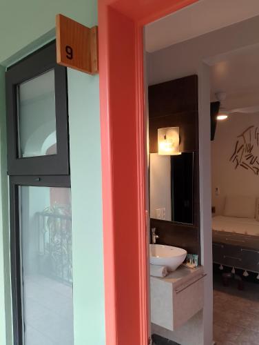 a bathroom with a sink and a mirror at Un Sueño Valle de Huajes in Oaxaca City