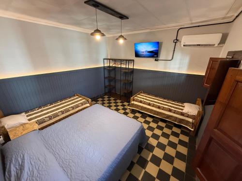 Ένα ή περισσότερα κρεβάτια σε δωμάτιο στο PyM