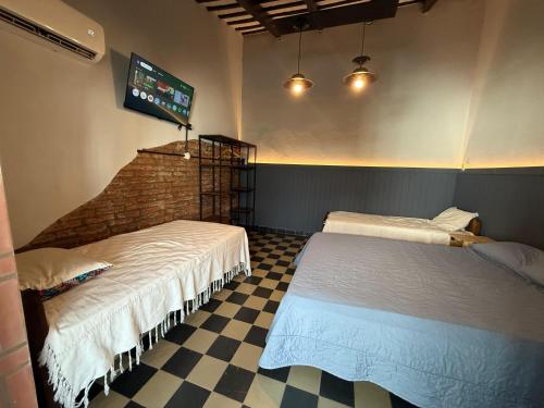 Ένα ή περισσότερα κρεβάτια σε δωμάτιο στο PyM