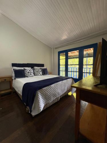 Postel nebo postele na pokoji v ubytování Pousada Dom Luiz