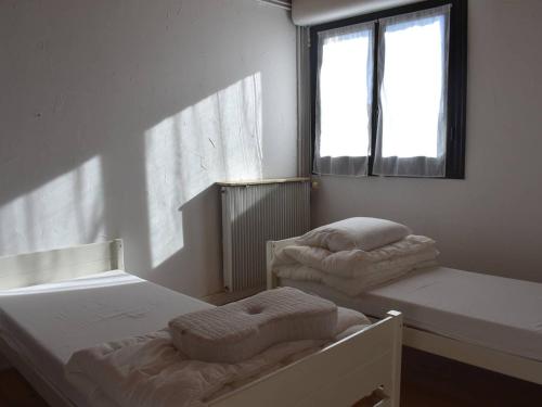 Кровать или кровати в номере Appartement 3 Pièces Ens. avec Garage, Pyrenees - FR-1-580-142