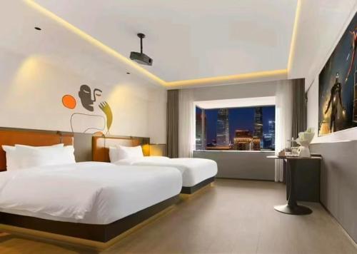 Una cama o camas en una habitación de Merica Hotel-ChongQing jiefangbei