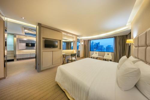 Ένα ή περισσότερα κρεβάτια σε δωμάτιο στο Royal Benja Hotel - Big Room Family-Friendly