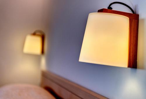 a pair of lights on a blue wall at Nissaki Beach Hotel in Naxos Chora