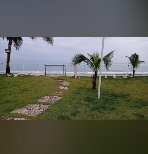 a volley ball hoop and palm trees on the beach at Luxury Cabarete East Condominiums in Cabarete