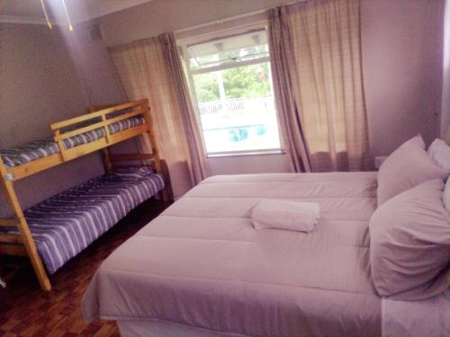 Ένα ή περισσότερα κρεβάτια σε δωμάτιο στο Peace of Mind Holiday Home