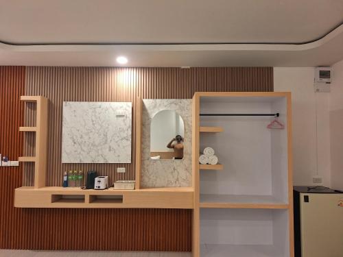 a room with a mirror on a wall at Lanta Mother House in Ko Lanta