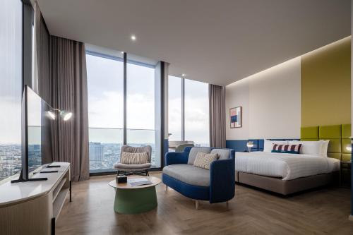 Postel nebo postele na pokoji v ubytování The Quarter Ramkhamhaeng by UHG