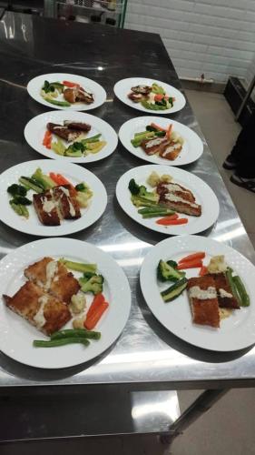 a group of plates of food on a table at Hotel pema raga in Thimphu