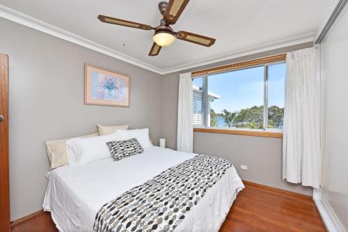 Ένα ή περισσότερα κρεβάτια σε δωμάτιο στο Wangi Point Escape