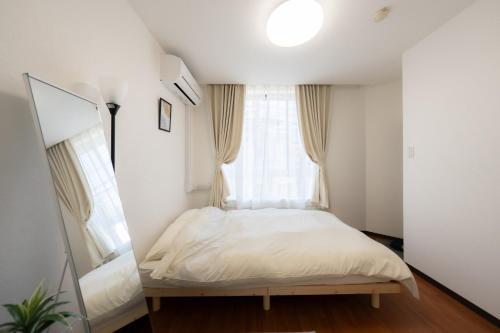 Ένα ή περισσότερα κρεβάτια σε δωμάτιο στο Casa G,S, - Vacation STAY 52837v