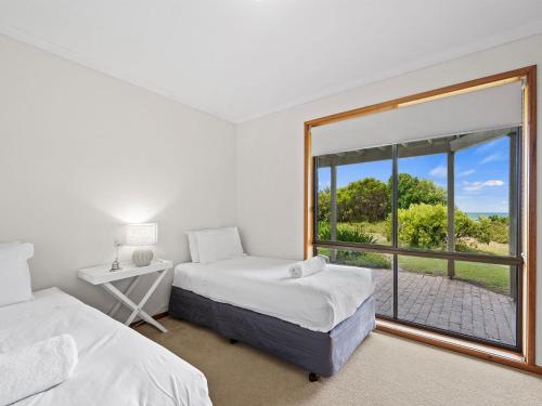 Postel nebo postele na pokoji v ubytování Waters Edge