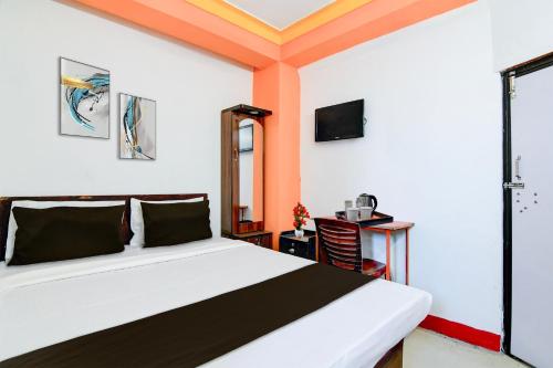 Una cama o camas en una habitación de Hotel O Swami Vivekananda University Kolkata