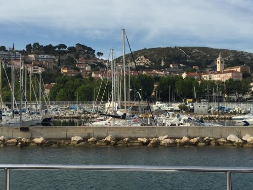 a marina with boats parked in the water at Maison d'Hôtes La Bastide Bleue in Marseille