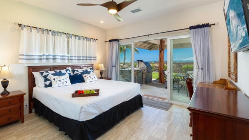 a bedroom with a bed and a sliding glass door at ❤PiH❤ Sunset Breeze Resort Pool Waterslide Passes Included Bikes in Waikoloa