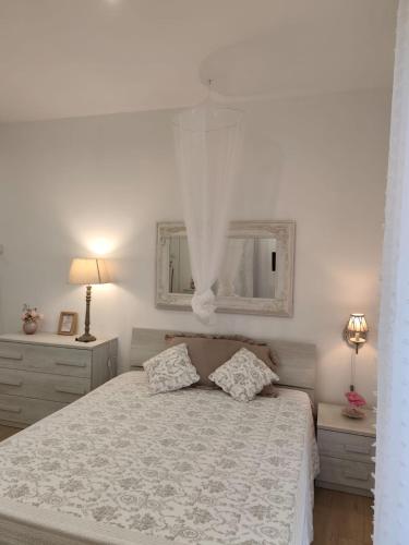 En eller flere senge i et værelse på affittacamere GOLD