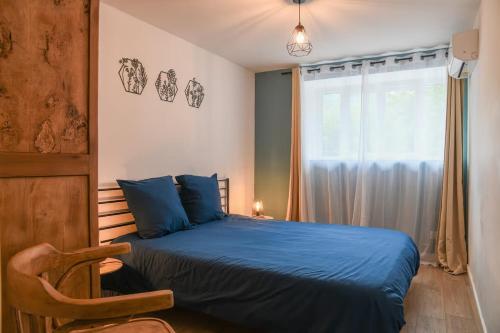 Postel nebo postele na pokoji v ubytování Charmante maison à Saint Béron