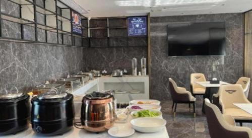 Una televisión o centro de entretenimiento en Echarm Hotel Zhuzhou Liling