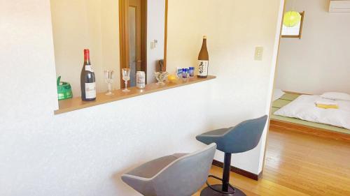 Postel nebo postele na pokoji v ubytování 富士見旅館