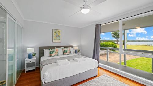 Ένα ή περισσότερα κρεβάτια σε δωμάτιο στο Riverside Retreat