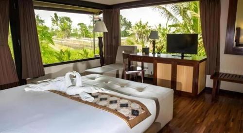 Кровать или кровати в номере Sambi Resort, Spa & Resto