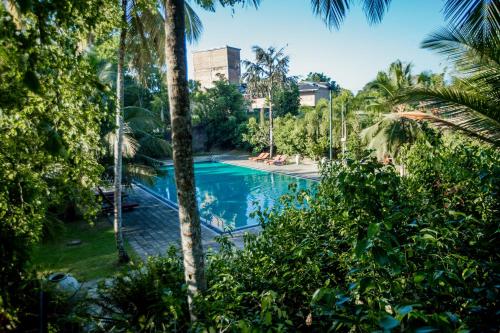 La alberca dentro o cerca de The Coastal Village Cabanas