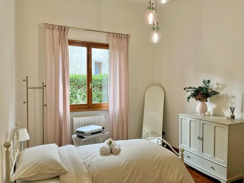 En eller flere senge i et værelse på La corte di Rolando - A Florence hideaway