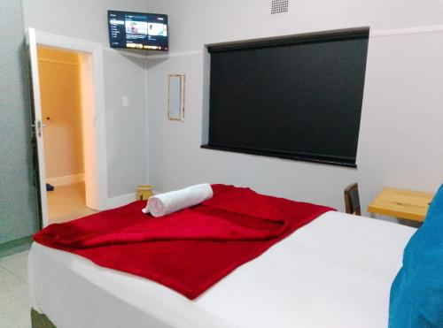 Ένα ή περισσότερα κρεβάτια σε δωμάτιο στο Neo & Ruks Guest Houses parow 4