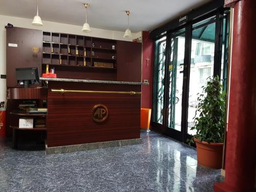 a lobby with a large wooden door in a building at Hotel Primavera in Naples