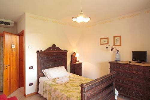 Postel nebo postele na pokoji v ubytování Agriturismo Il Magicorto
