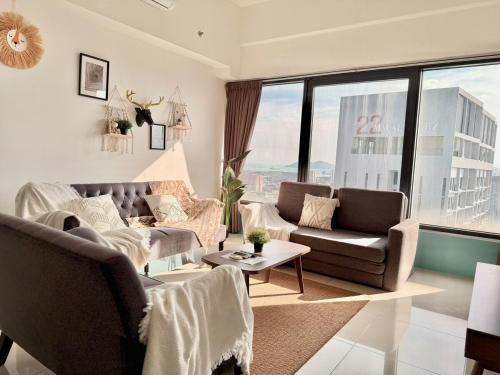 a living room with two couches and a large window at Tropicana 218 Macalister #Top Floor #WideAngleViews #InfinityPool #Georgetown #8pax #3BR 2bath #2Queen 4Single #Near island hospital #Quality well maintained #Private host in George Town