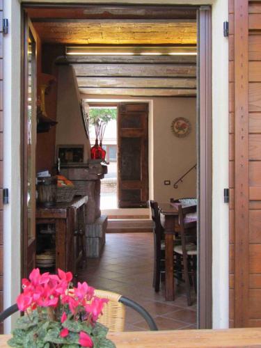 a view of a kitchen and dining room with a table at La Casetta in Penna in Teverina