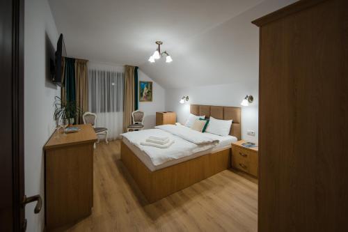 En eller flere senge i et værelse på Casa PEANA