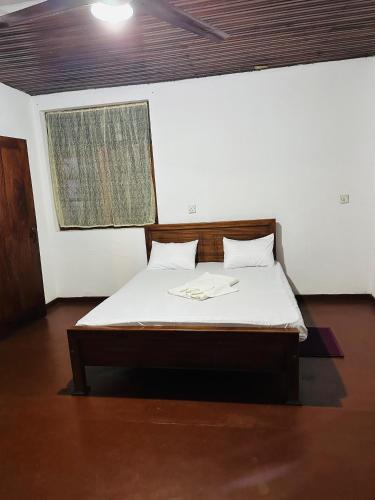 Ένα ή περισσότερα κρεβάτια σε δωμάτιο στο Pawana Hotel