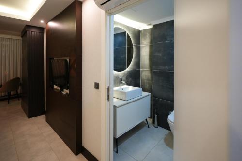 a bathroom with a sink and a toilet at Visse Hotel in Mudanya