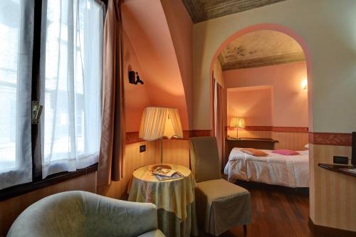 מיטה או מיטות בחדר ב-Hotel Due Mondi