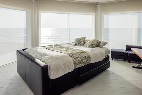 Postel nebo postele na pokoji v ubytování at SUNSET VILLA いなみ