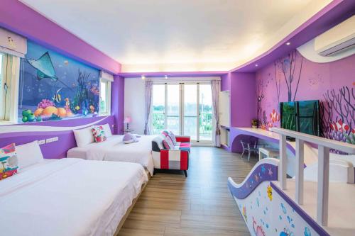 Postel nebo postele na pokoji v ubytování Fish Nest Villa 宜蘭親子包棟民宿 戲水池 歡唱 代訂晚餐