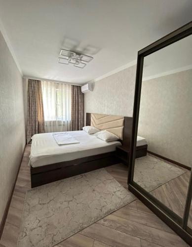 Giường trong phòng chung tại Arbat view