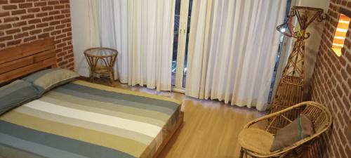 Ένα ή περισσότερα κρεβάτια σε δωμάτιο στο Kayo Homes