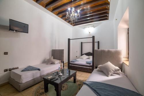 Postel nebo postele na pokoji v ubytování Riad Oussari