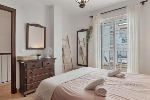 En eller flere senge i et værelse på Casita De La Luz with swimmingpool