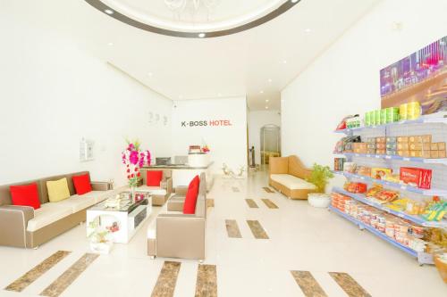 a store with couches and tables in a room at K-BOSS Hotel in Bắc Ninh