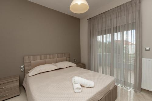 Postel nebo postele na pokoji v ubytování Mary Luxury House