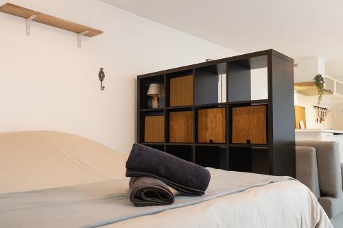 En eller flere senge i et værelse på Le Loft Proche Gare 800 m