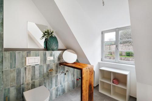a room with a table and a window at Historische Werkstatt in Gernsbach