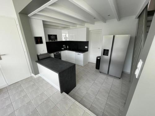 Køkken eller tekøkken på L'Eucalyptus, charmante maison familiale, Arago